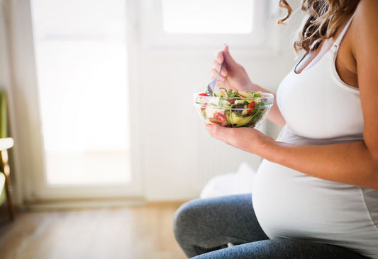Pregnant woman having pregnancy cravings - eating a healthy meal - BabyHeart Australia
