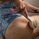 Zobelle Sonica Silicone Body Brush being used on the thigh