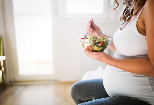 Pregnant woman having pregnancy cravings - eating a healthy meal - BabyHeart Australia