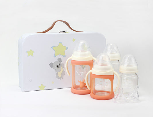 Simple product shot of the Cherub Baby Starter Kit and small metal suitcase