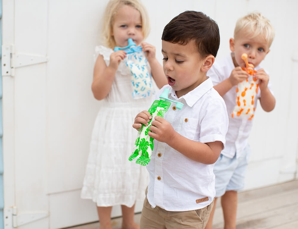 3 toddlers enjoying their drink from the on the go Maxi pouches